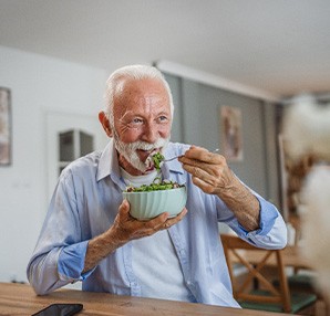 An older man eating a nutritious meal